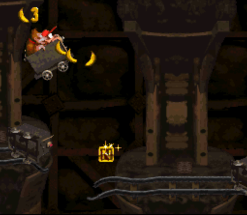 Screenshot from Donkey Kong Country. Not only are the Mine Cart levels the most difficult, timing this particular jump to get that 